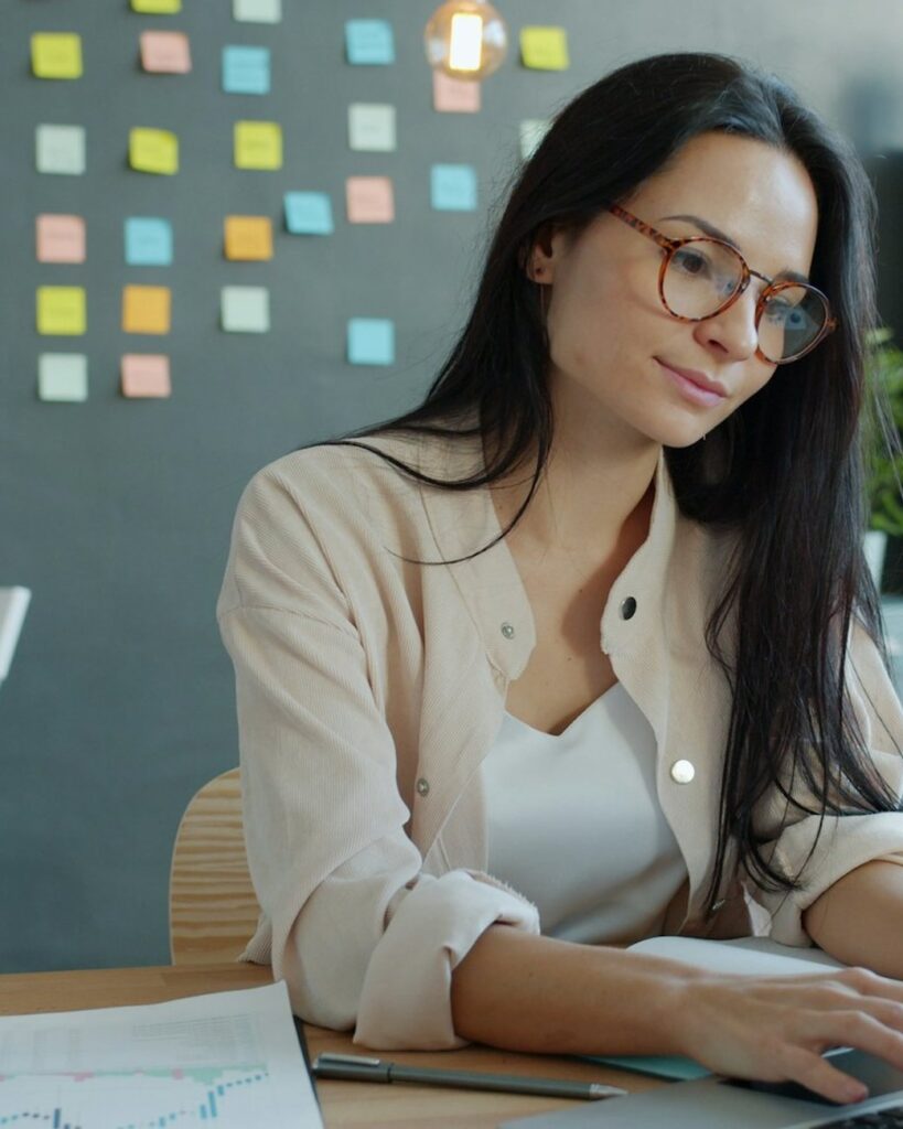 Digital marketing strategist planning a campaign on a laptop