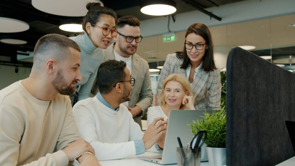 Marketing team collaborating on a client growth strategy